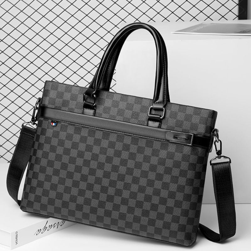 Gray checkered briefcase with black accents on a white background