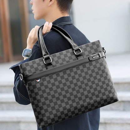 Person holding a gray checkered briefcase with a blurred background