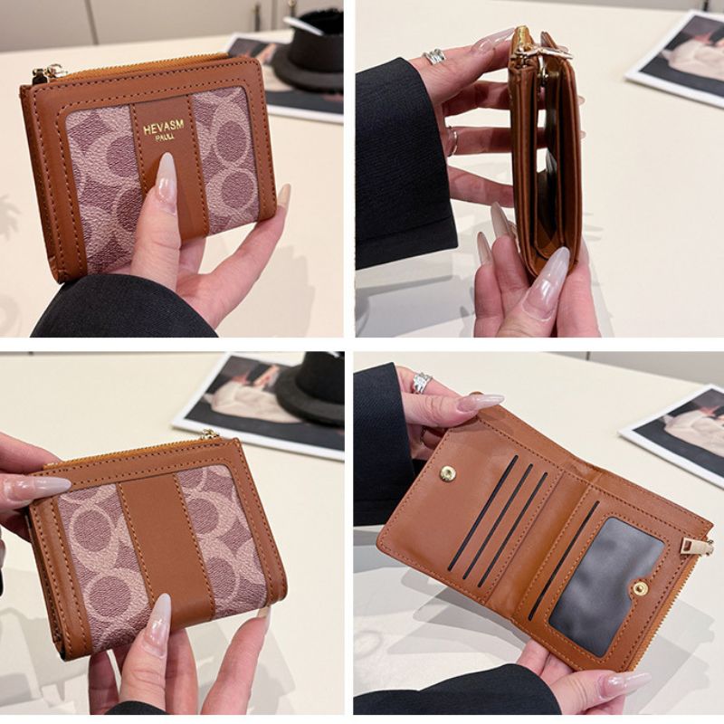 Brown wallet with patterned accents held by hands on a light background