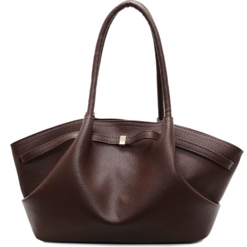 Brown leather handbag on a white background