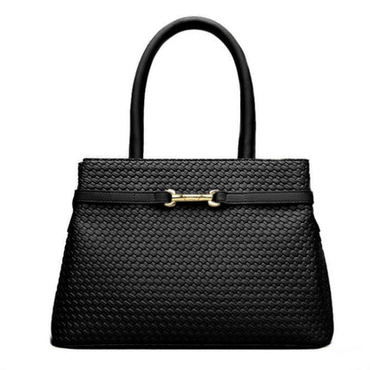 Black woven handbag with a gold clasp on a white background